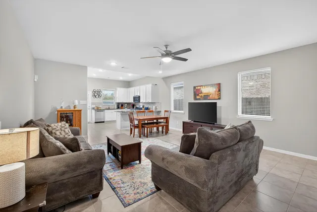 a living room with furniture and a window
