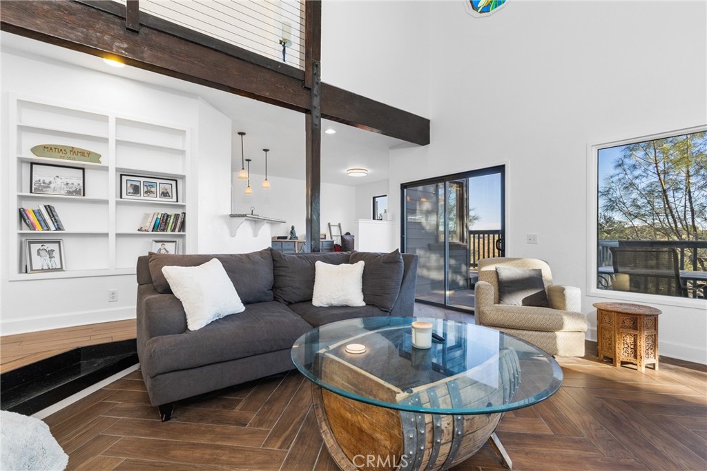 8110 Castenada Lane Atascadero, CA 93422 - Photo 11 of 75 The living room has built-in shelves next to the fireplace and also on the back wall.
