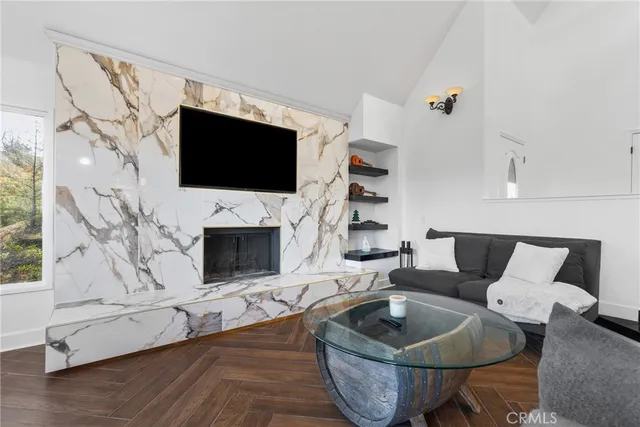 a kitchen with kitchen island granite countertop a sink a counter top space and cabinets
