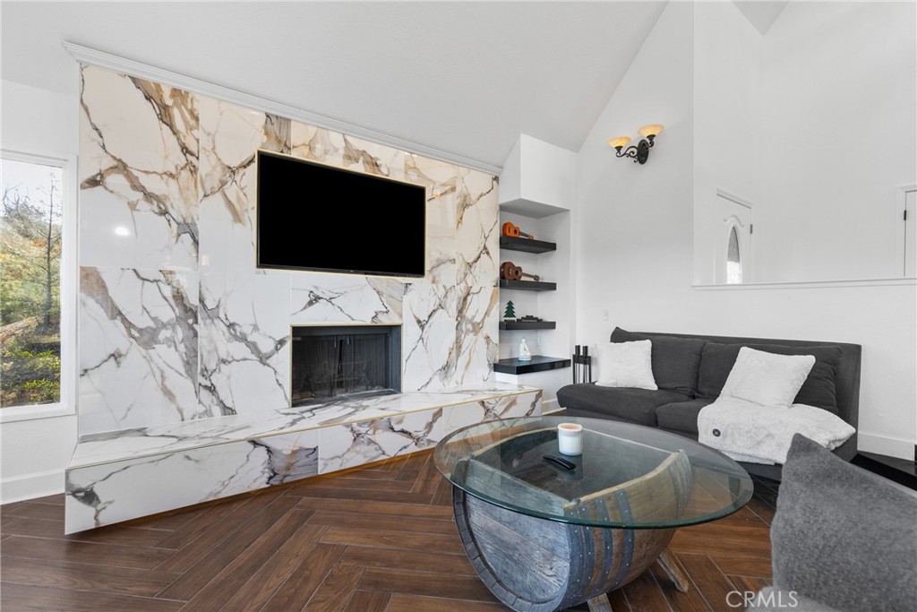 8110 Castenada Lane Atascadero, CA 93422 - Photo 13 of 75 a living room with furniture a flat screen tv and a fireplace