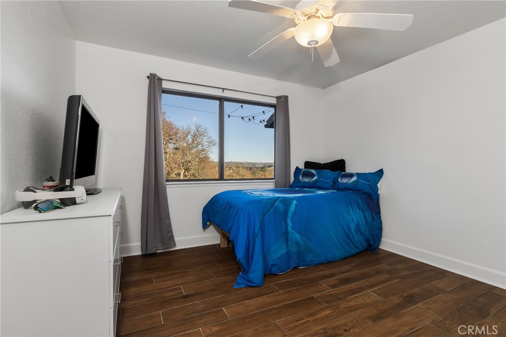 8110 Castenada Lane Atascadero, CA 93422 - Photo 30 of 75 a bedroom with a bed and a flat screen tv