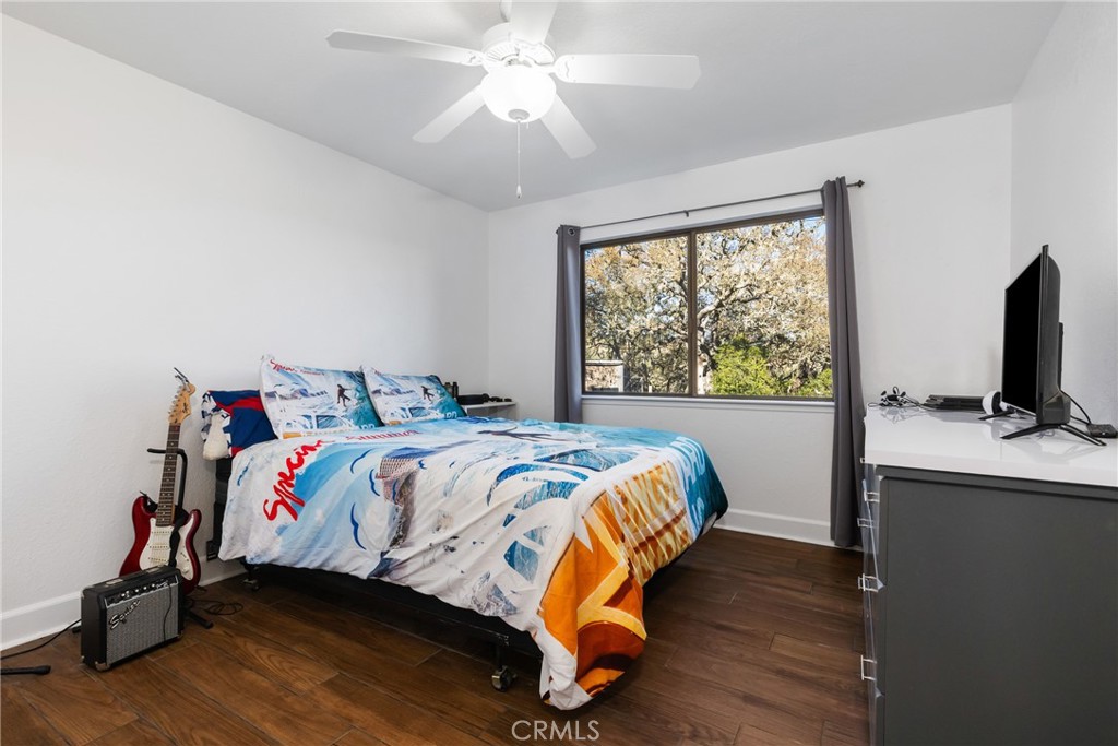 8110 Castenada Lane Atascadero, CA 93422 - Photo 32 of 75 a bedroom with a bed and a large window