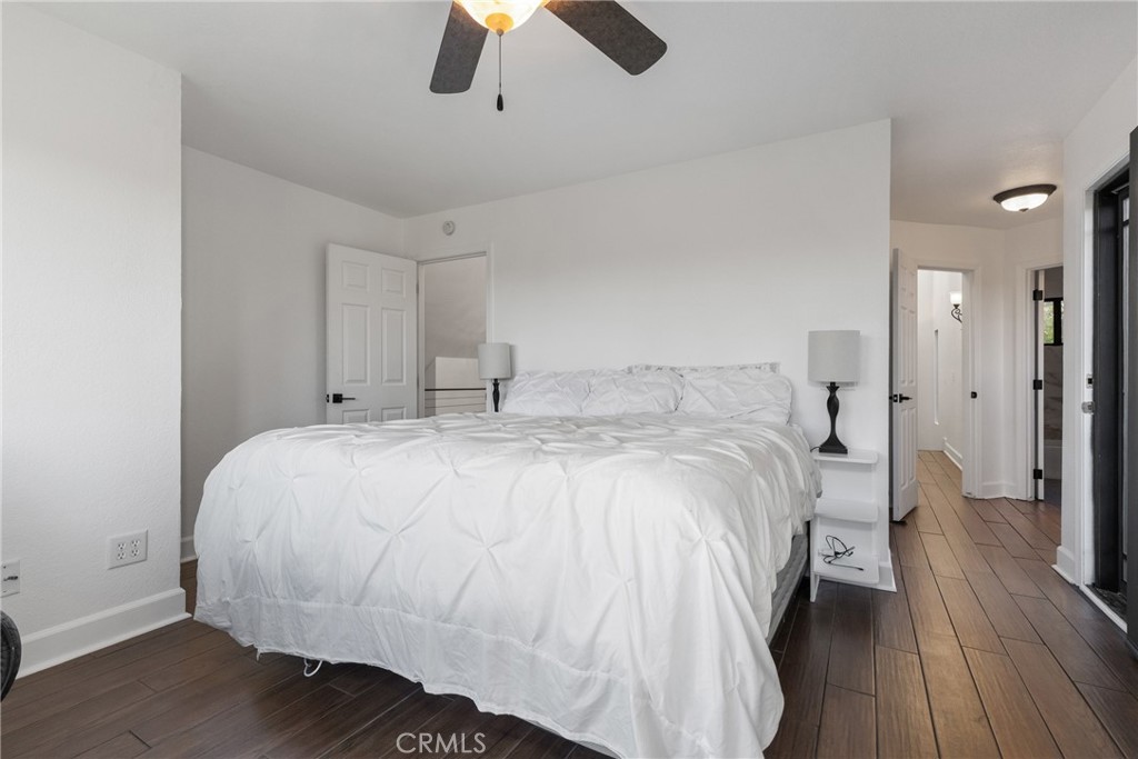 8110 Castenada Lane Atascadero, CA 93422 - Photo 39 of 75 a bedroom with a bed and a chandelier