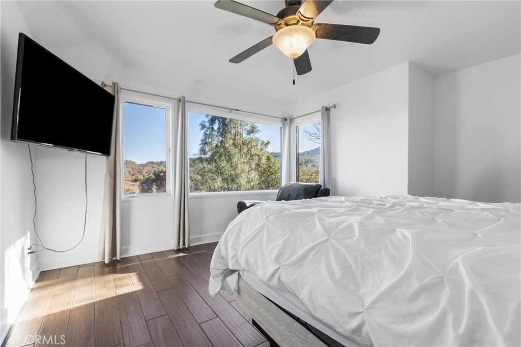 8110 Castenada Lane Atascadero, CA 93422 - Photo 41 of 75 a spacious bedroom with a bed and a flat screen tv