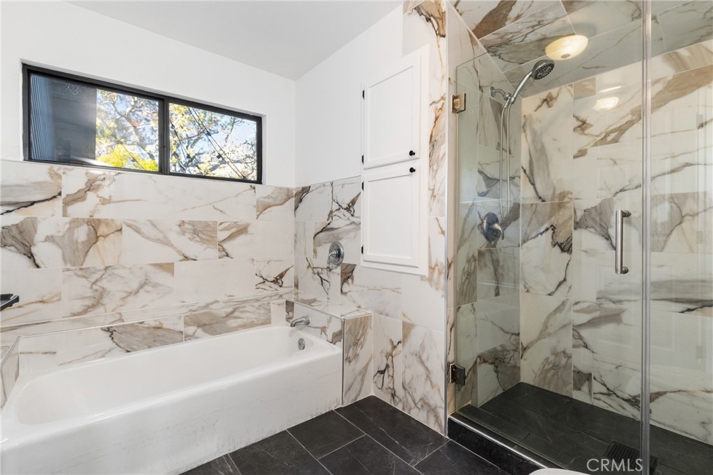 8110 Castenada Lane Atascadero, CA 93422 - Photo 44 of 75 a bathroom with a bathtub and window