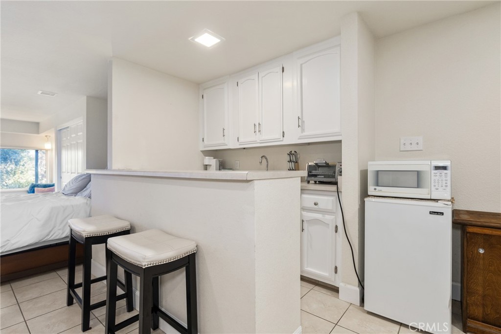8110 Castenada Lane Atascadero, CA 93422 - Photo 49 of 75 a kitchen with a sink cabinets and refrigerator