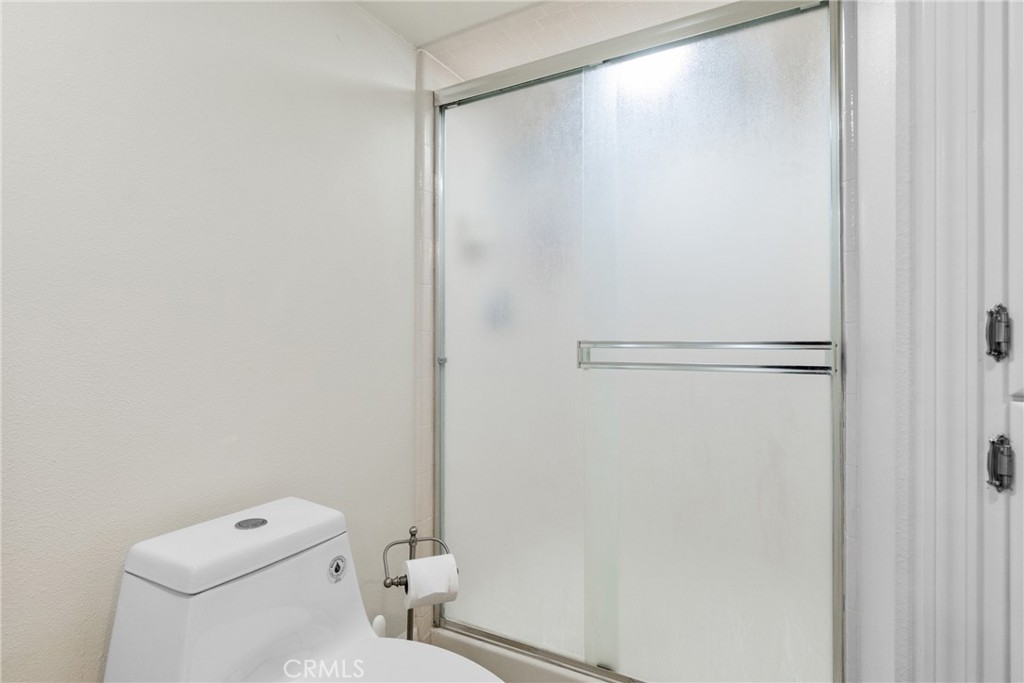 8110 Castenada Lane Atascadero, CA 93422 - Photo 53 of 75 a white toilet sitting next to a shower