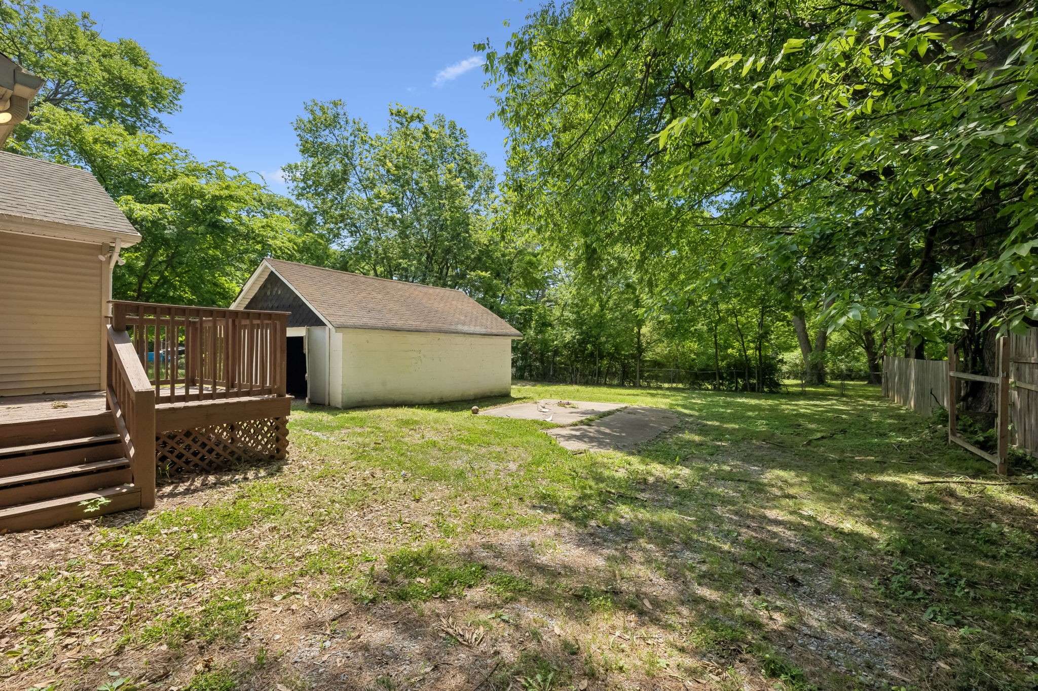 511 Hayes Street Springfield, TN 37172 - Photo 24 of 26 a backyard of a house with trees and outdoor seating