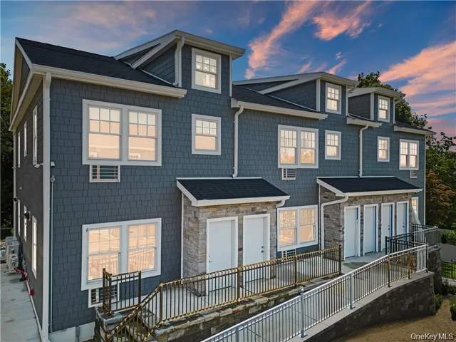 a view of living room with furniture and wooden floor