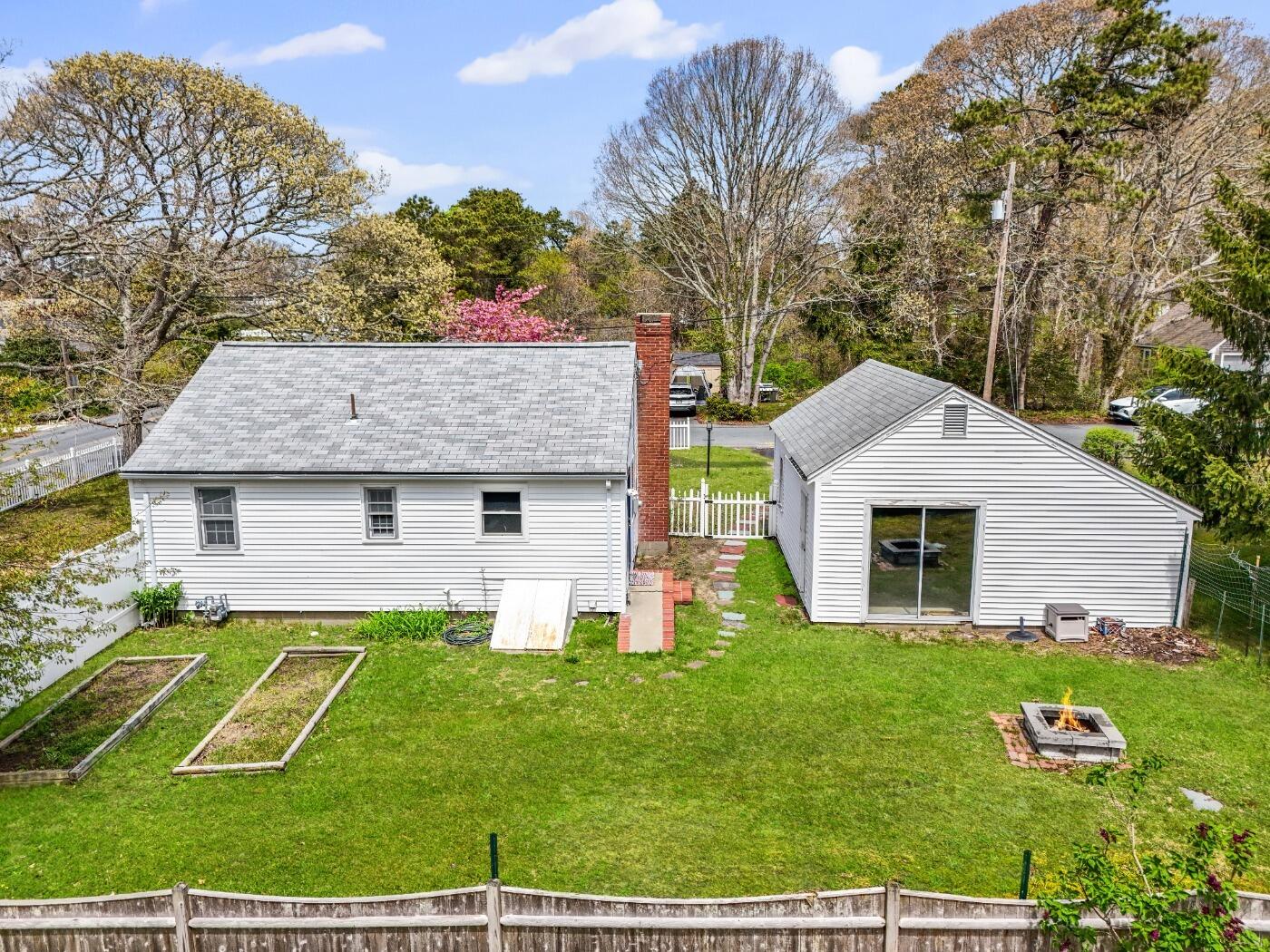 1 Gilbert Road Dennis Port, MA 02639 - Photo 3 of 27 a view of a house with a big yard