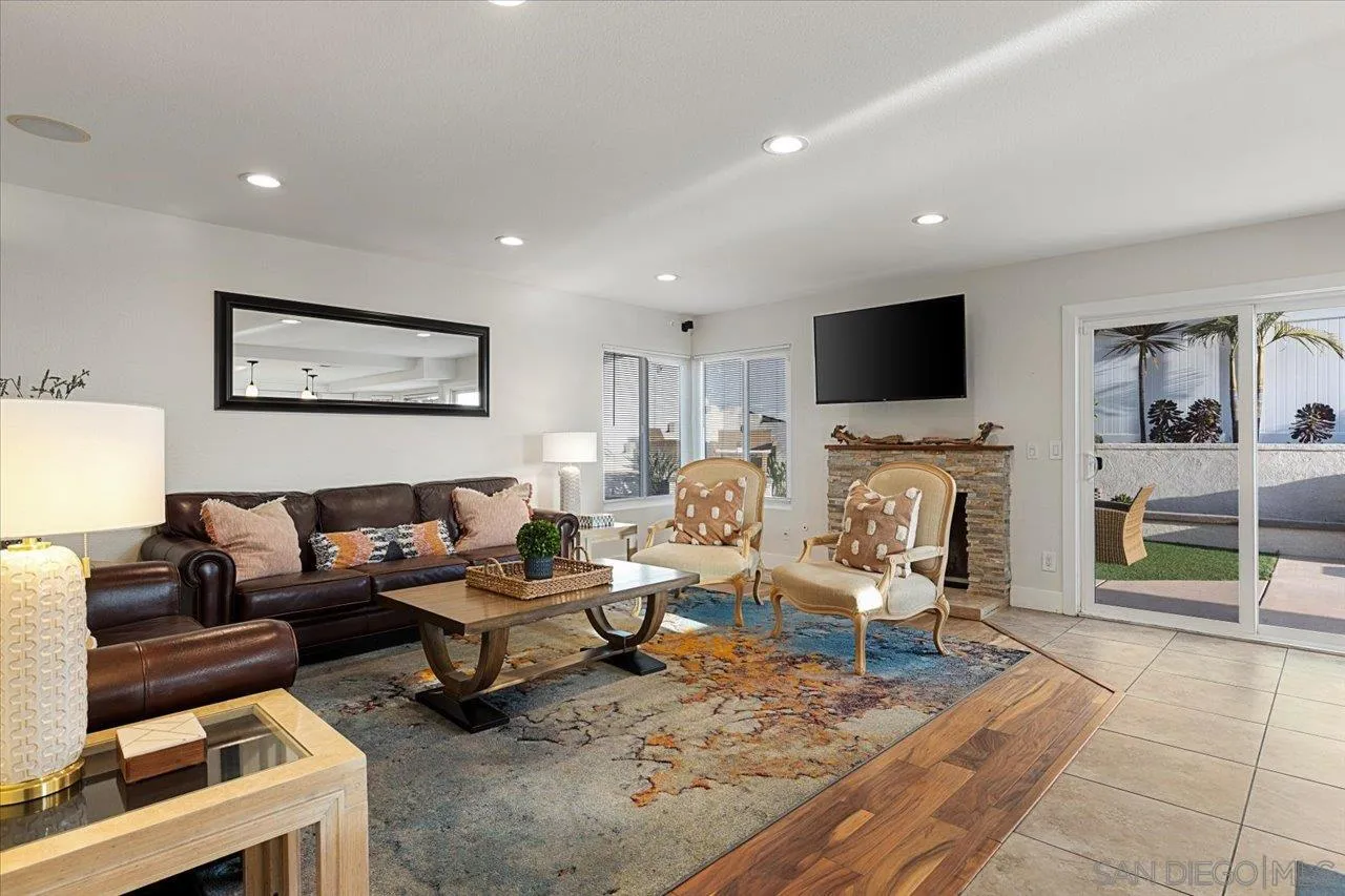 1321 Clear Crest Circle Vista, CA 92084 - Photo 11 of 30 a living room with furniture a fireplace and a flat screen tv