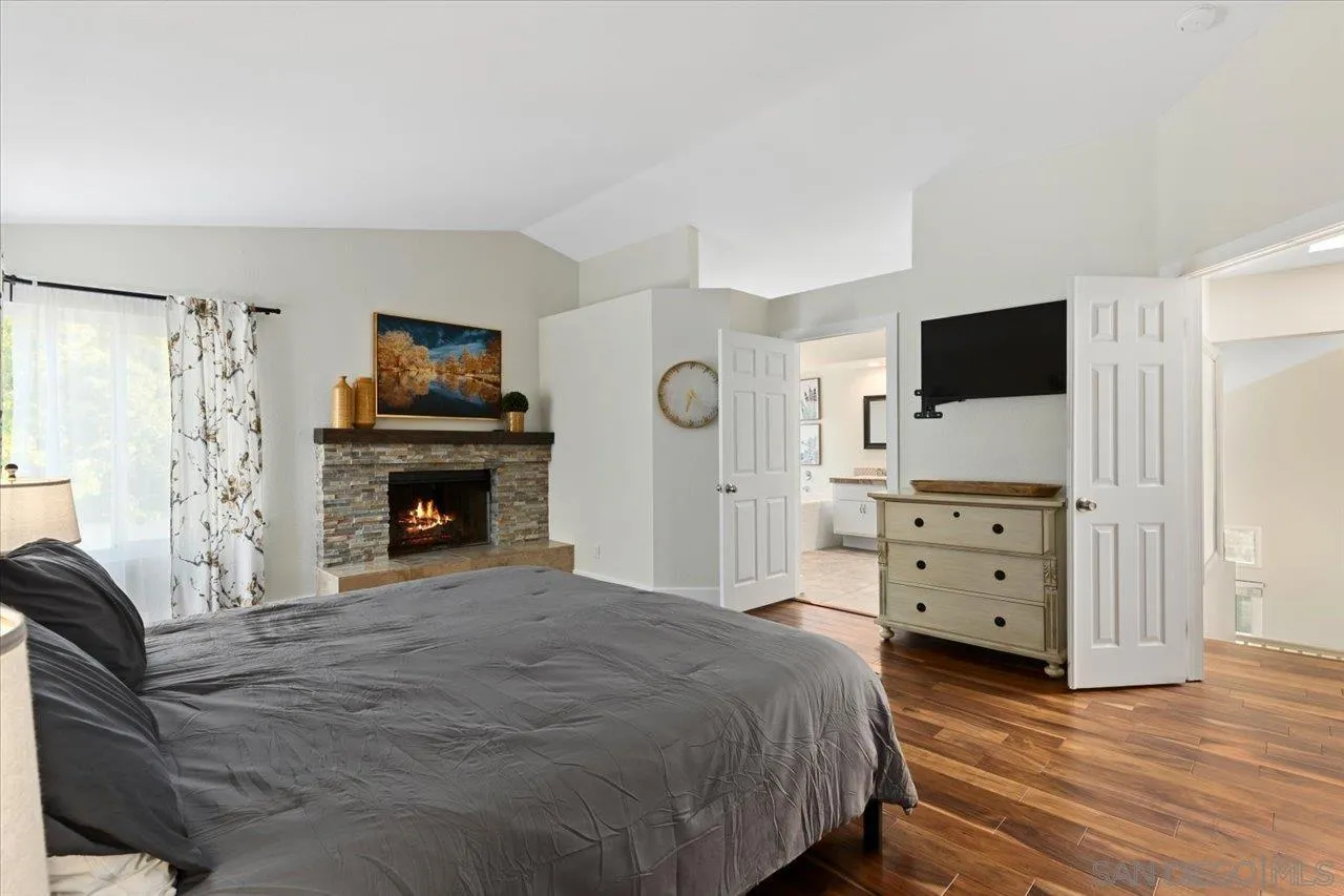 1321 Clear Crest Circle Vista, CA 92084 - Photo 16 of 30 a bedroom with a bed and a television