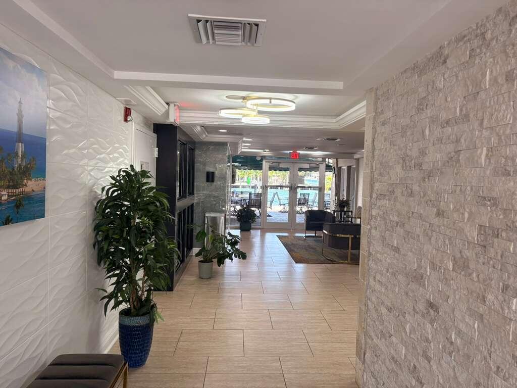 2611 North Riverside Drive, Unit 703 Pompano Beach, FL 33062 - Photo 54 of 81 a lobby with furniture and potted plants