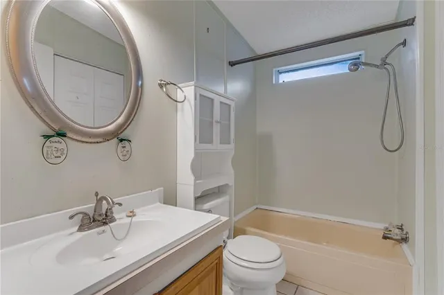 a bedroom with a bed and glass window