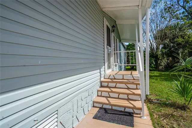 a large kitchen with stainless steel appliances granite countertop a stove a sink and a microwave