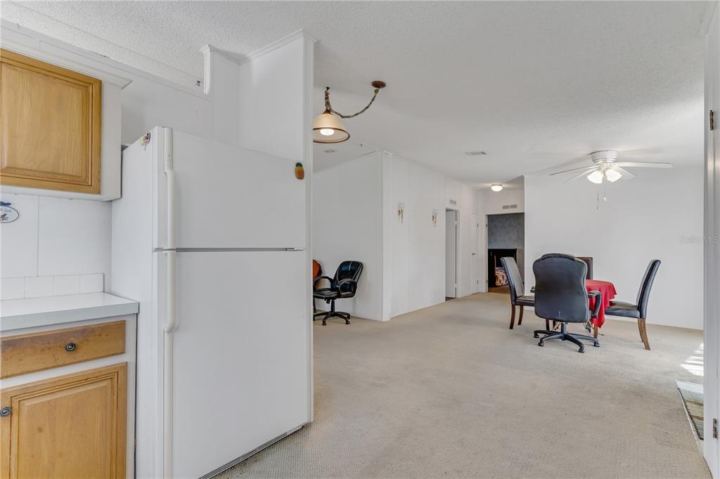 300 Beech Court Cocoa, FL 32926 - Photo 4 of 32 a living room with furniture a dining table and chairs