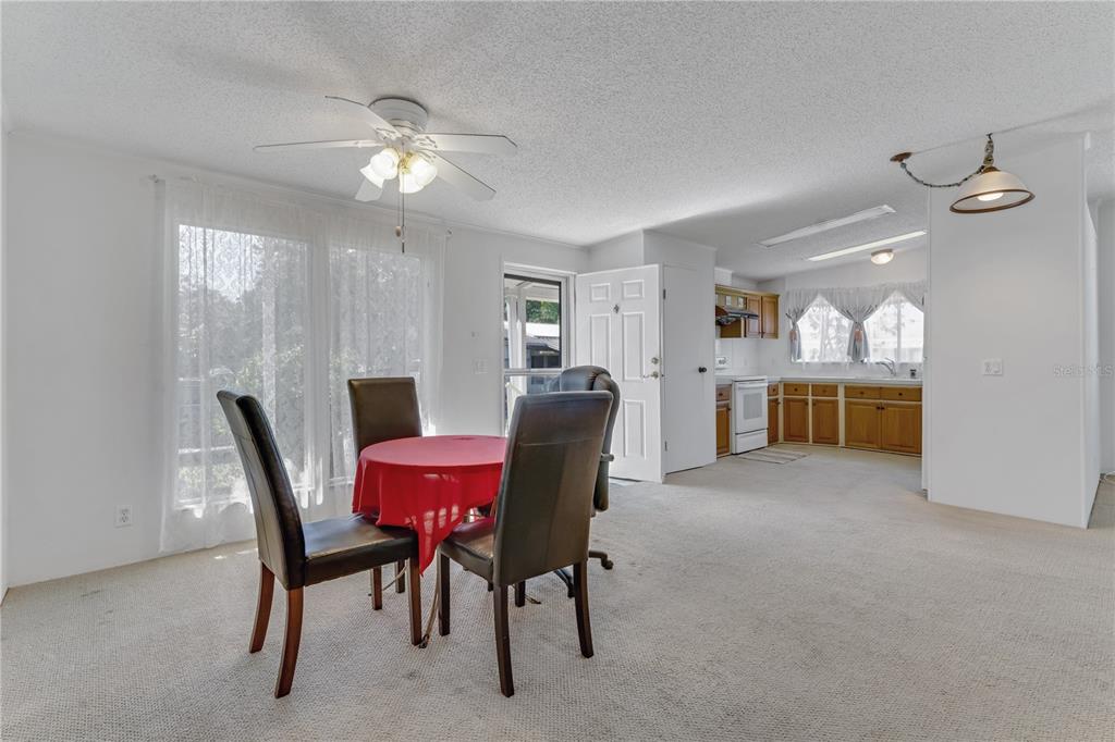 300 Beech Court Cocoa, FL 32926 - Photo 5 of 32 a view of a dining room with furniture wooden floor and chandelier
