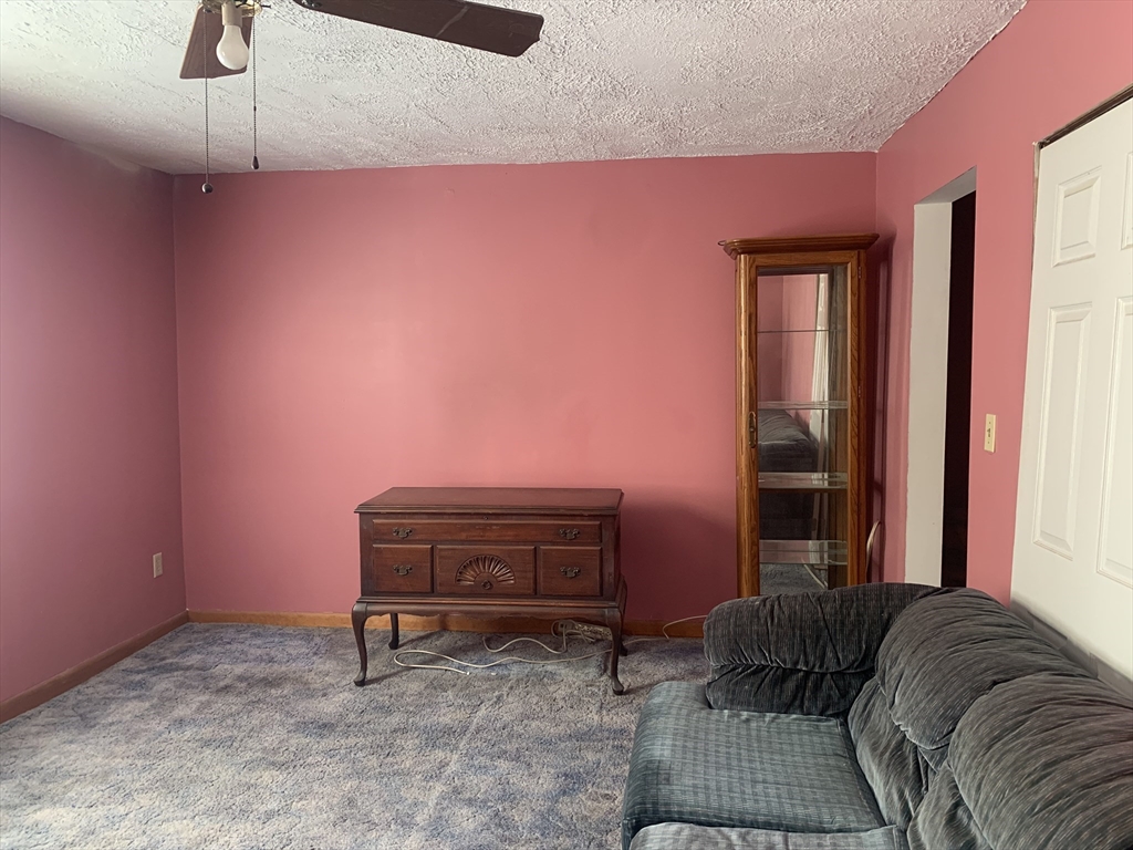 8 Avon Place Boston, MA 02129 - Photo 12 of 23 a living room with furniture and a piano
