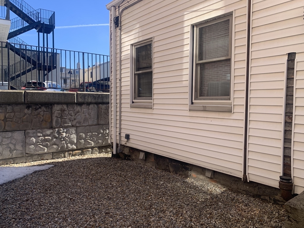 8 Avon Place Boston, MA 02129 - Photo 22 of 23 a view of a house with a yard