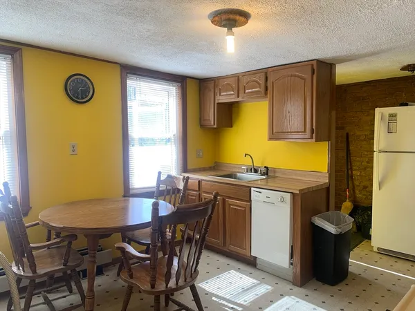 a view of a dining room with furniture and a table