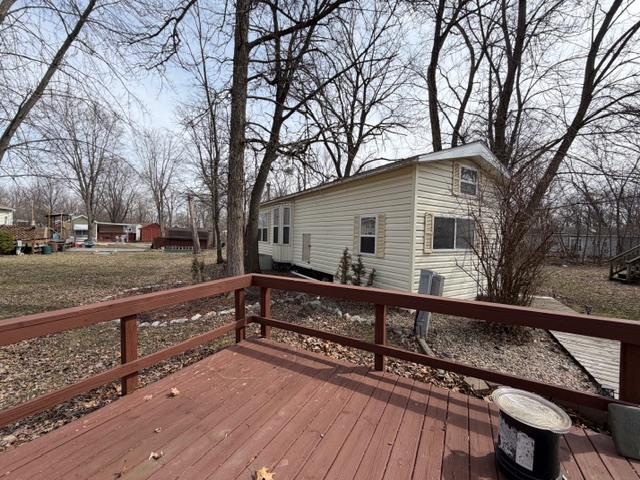 2795 East 28th Road Marseilles, IL 61341 - Photo 3 of 69 a view of a house with wooden deck and trees