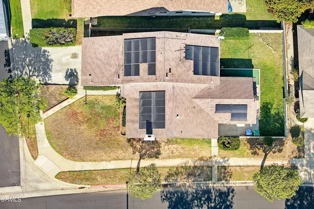 a aerial view of a house with a swimming pool