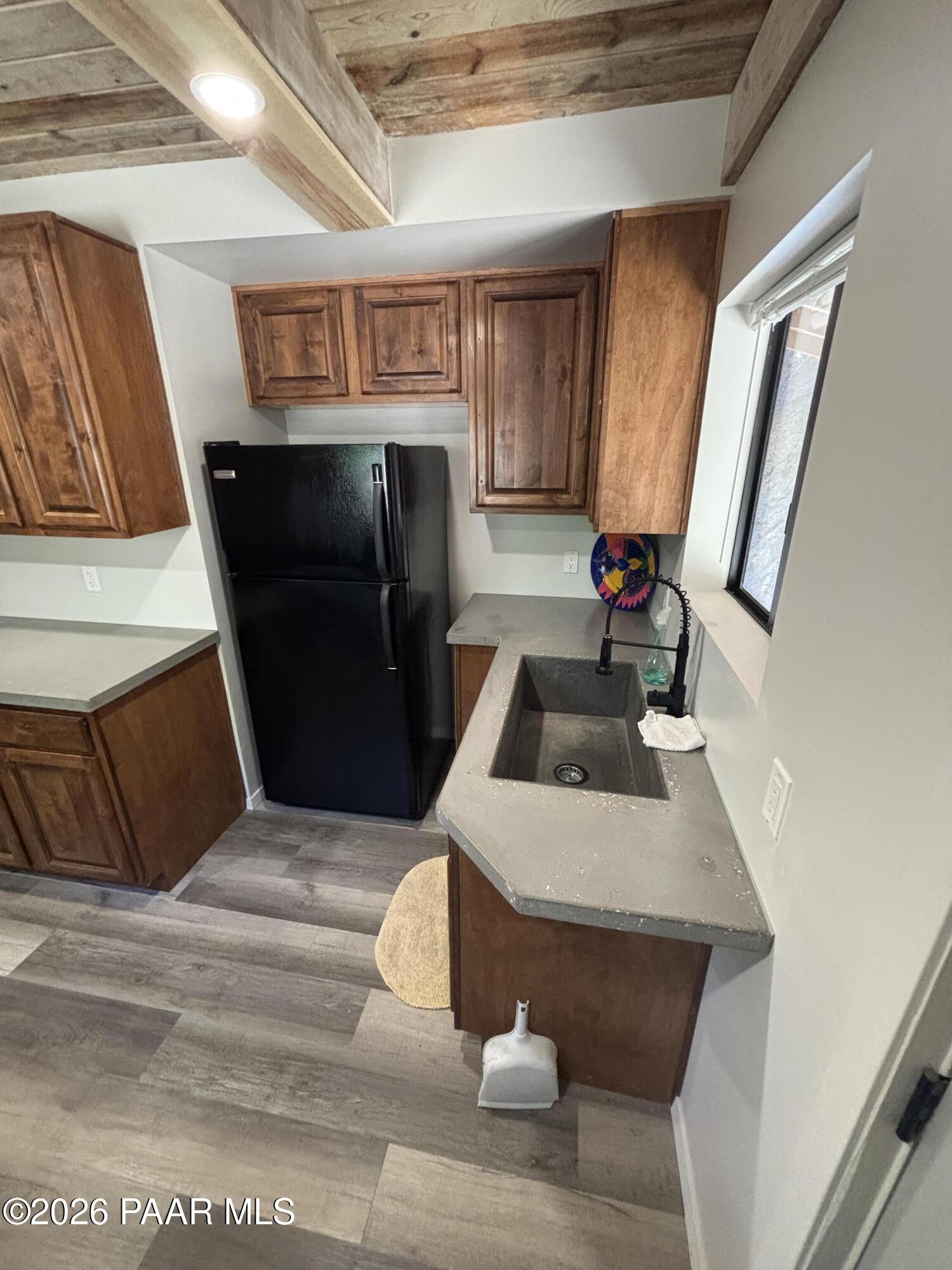 8550 South Breezy Pine Road Mayer, AZ 86333 - Photo 19 of 40 a kitchen with a sink appliances and cabinets