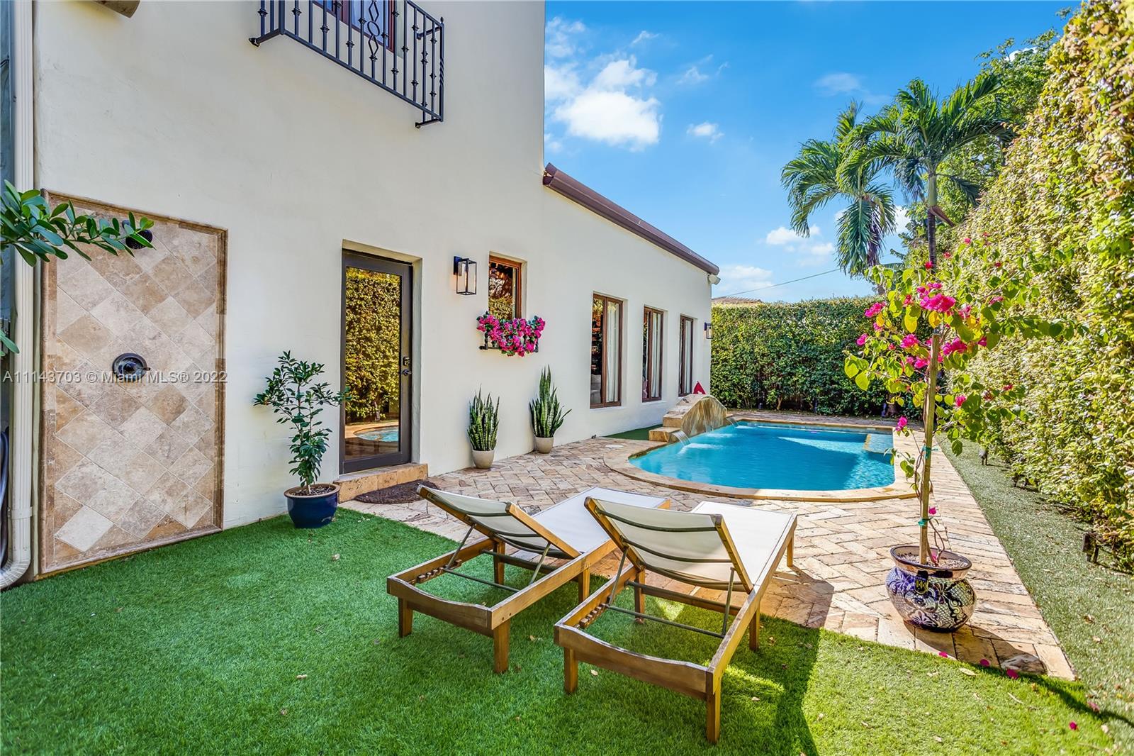 4422 Alton Road Miami Beach, FL 33140 - Photo 27 of 37 a view of a backyard with furniture and garden