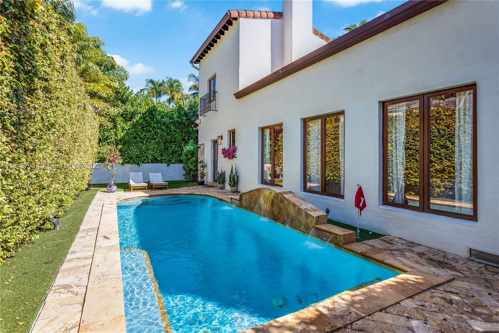 4422 Alton Road Miami Beach, FL 33140 - Photo 30 of 37 a swimming pool with outdoor seating