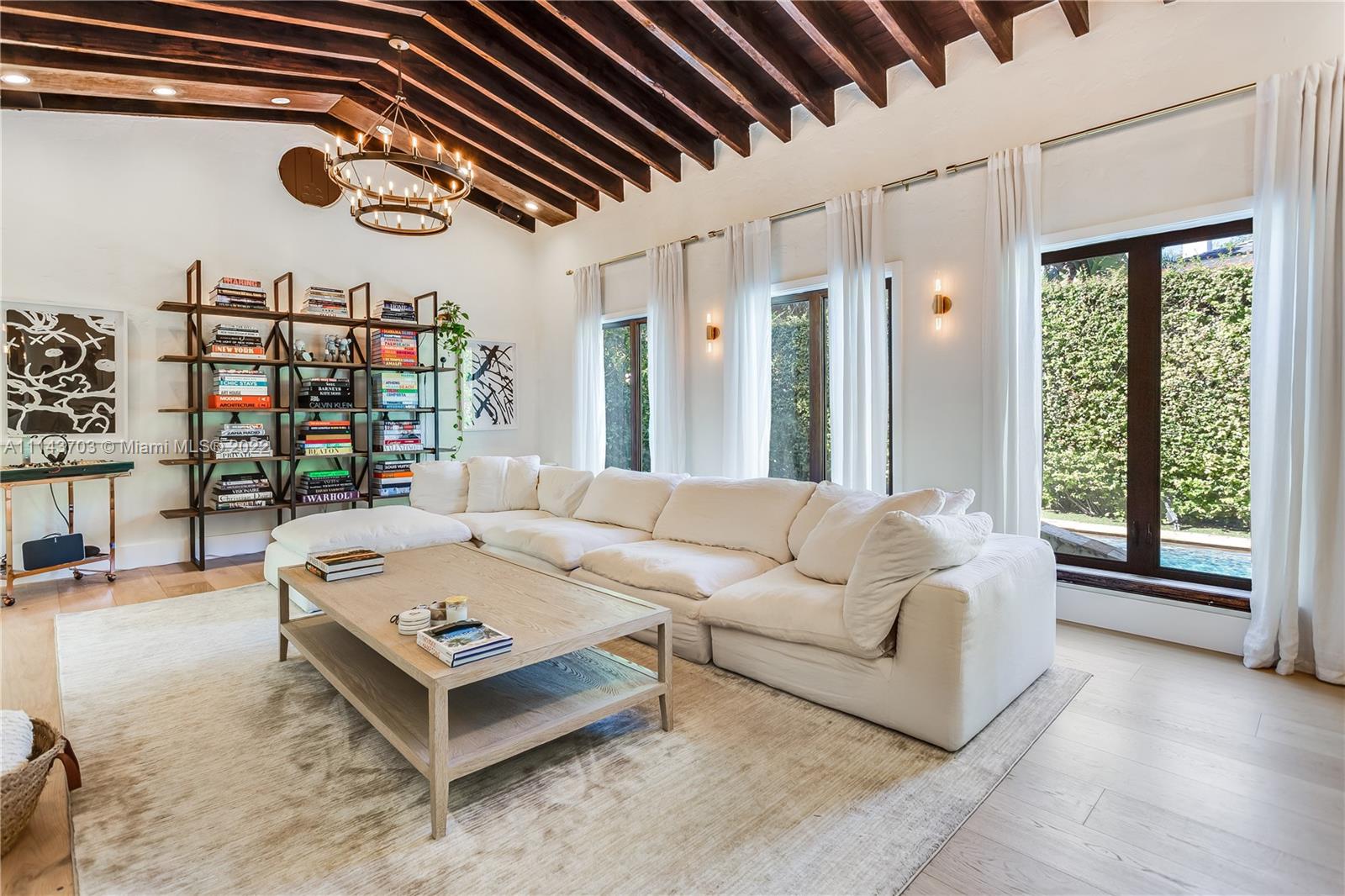 4422 Alton Road Miami Beach, FL 33140 - Photo 3 of 37 a living room with furniture and a large window
