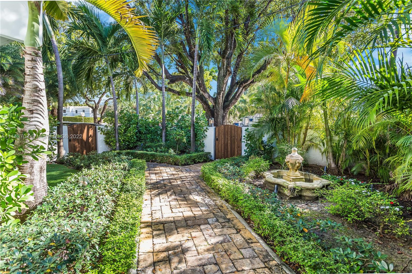 4422 Alton Road Miami Beach, FL 33140 - Photo 32 of 37 a front view of a house with a yard