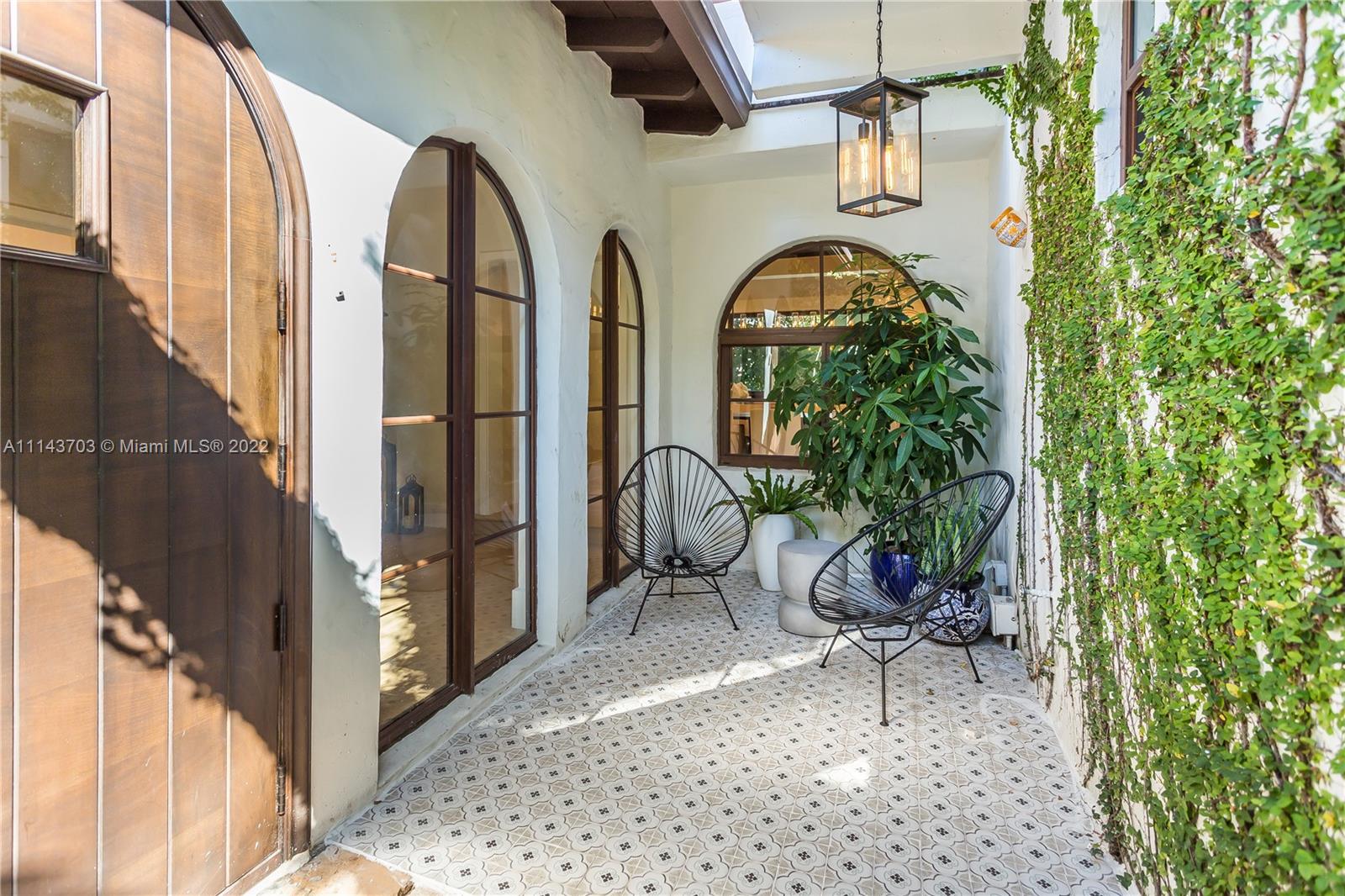 4422 Alton Road Miami Beach, FL 33140 - Photo 34 of 37 a view of entryway with garden