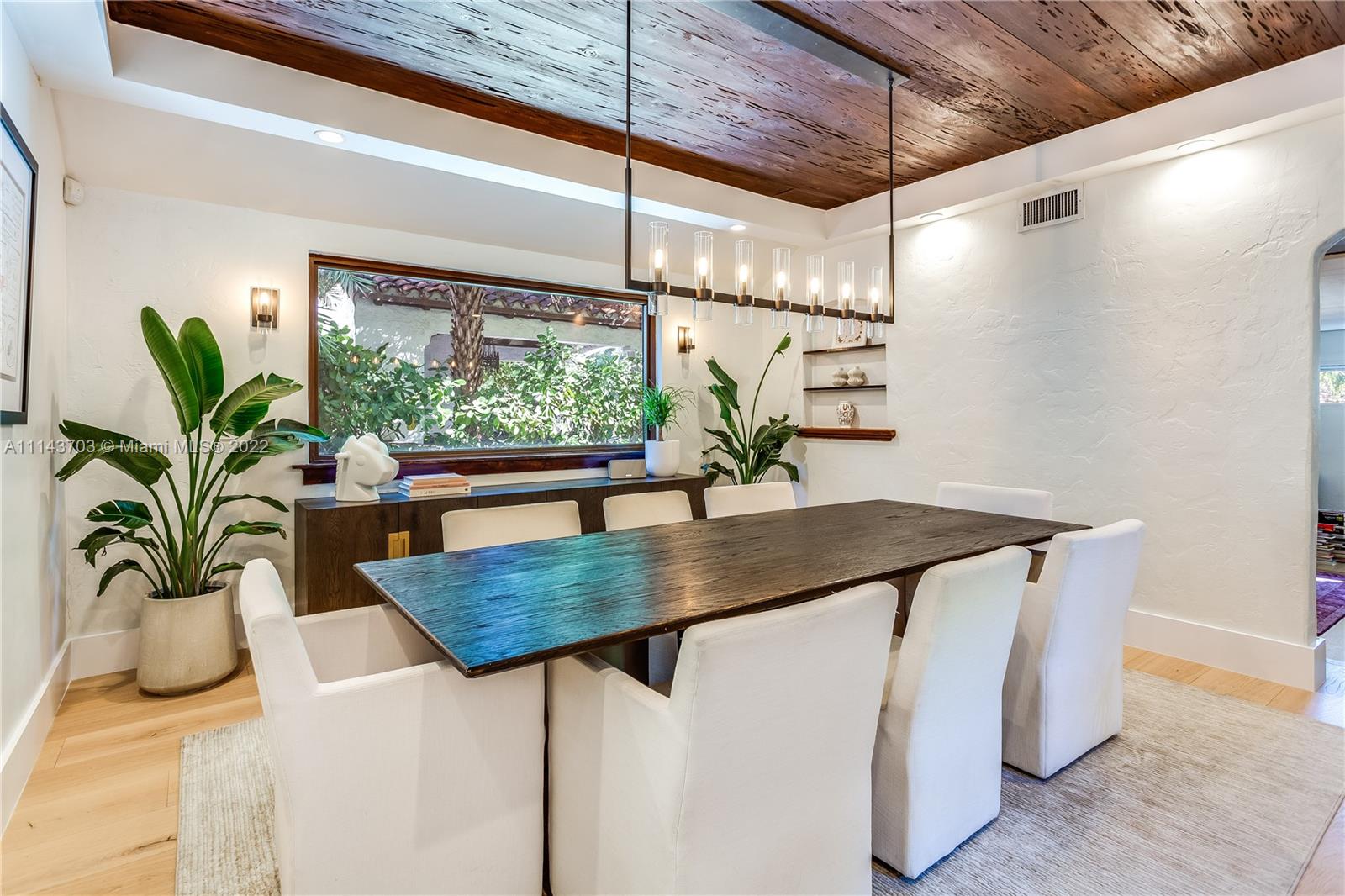 4422 Alton Road Miami Beach, FL 33140 - Photo 6 of 37 a view of table and chair in the house