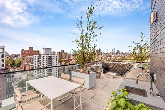 a view of a city with tall buildings