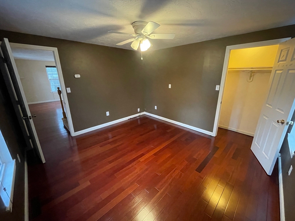 16 Bowstring Way Marlborough, MA 01752 - Photo 11 of 25 wooden floor in an empty room with a window