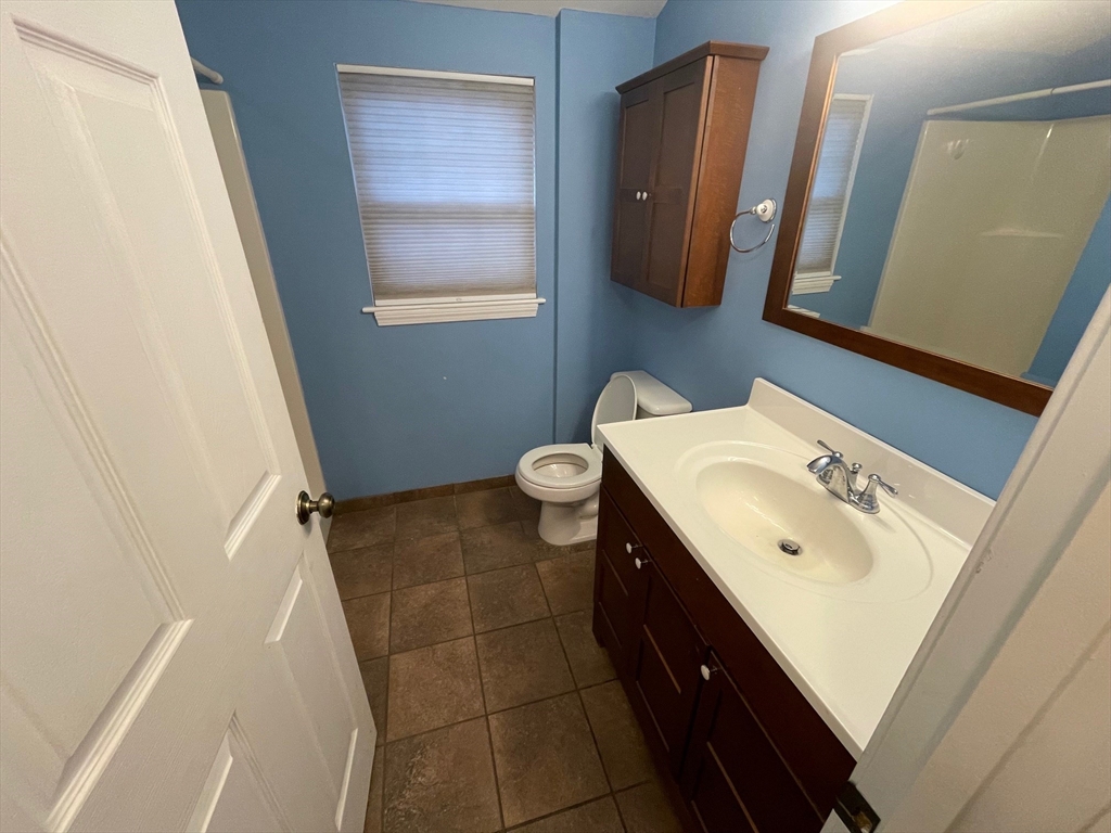 16 Bowstring Way Marlborough, MA 01752 - Photo 16 of 25 a bathroom with a sink a toilet and a mirror