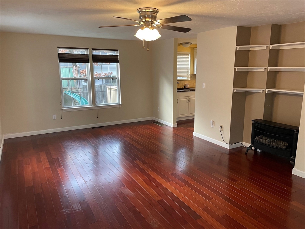 16 Bowstring Way Marlborough, MA 01752 - Photo 5 of 25 wooden floor in an empty room with a window