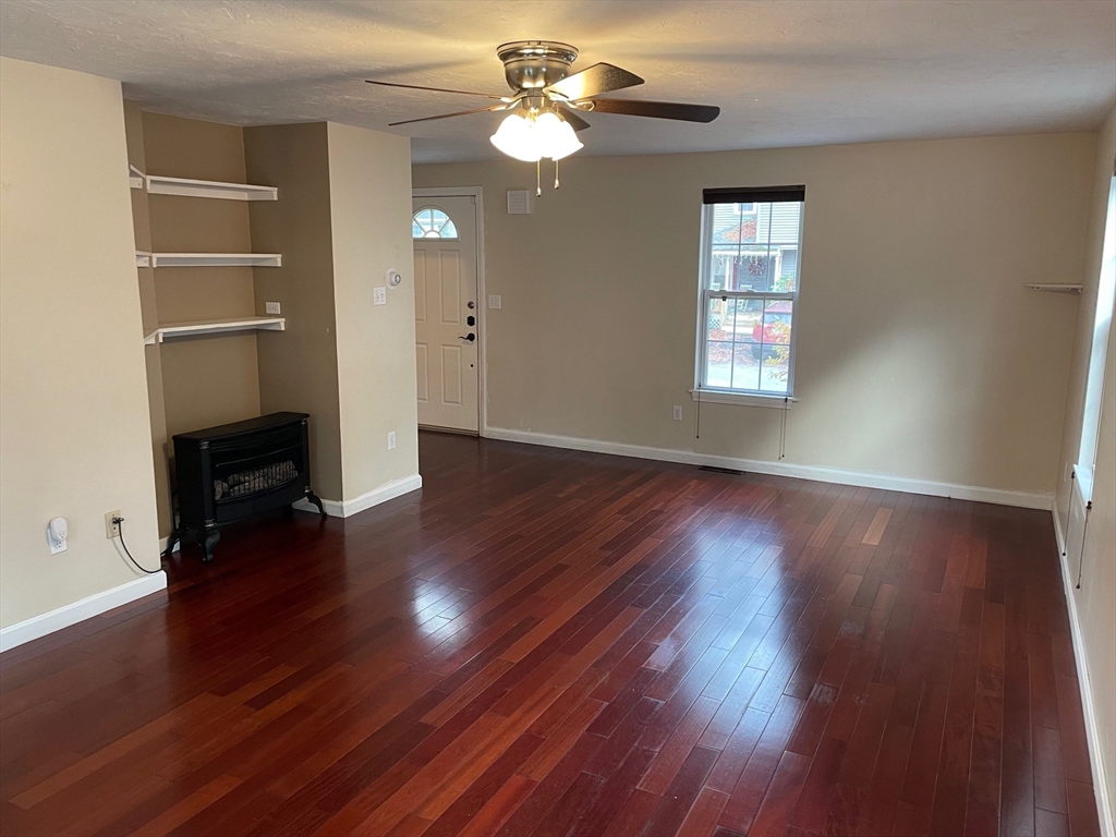 16 Bowstring Way Marlborough, MA 01752 - Photo 6 of 25 a view of empty room with wooden floor and fan