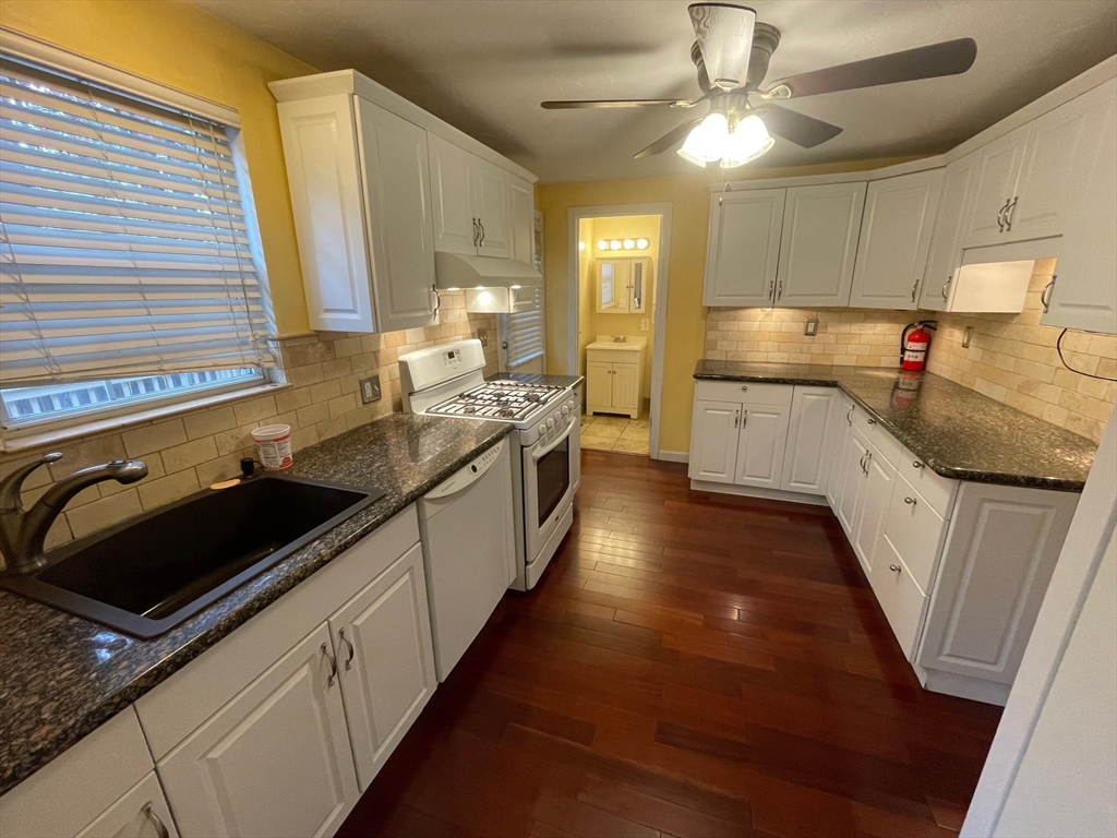 16 Bowstring Way Marlborough, MA 01752 - Photo 7 of 25 a kitchen with a sink stove and cabinets