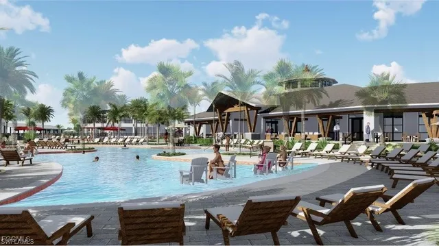 a view of a swimming pool with outdoor seating