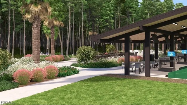 a view of a patio with table and chairs under an umbrella