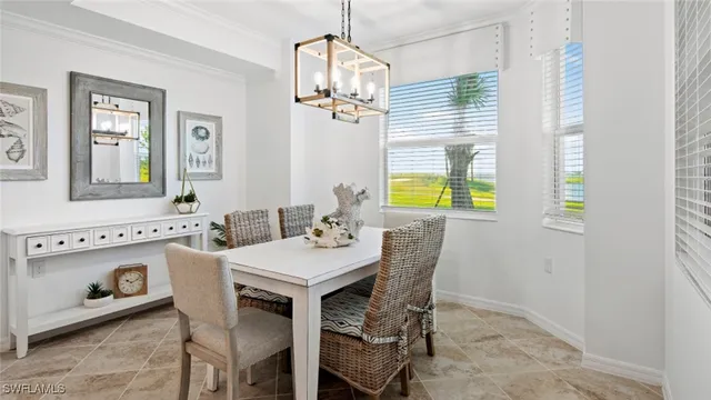 a view of a dining room with furniture and window