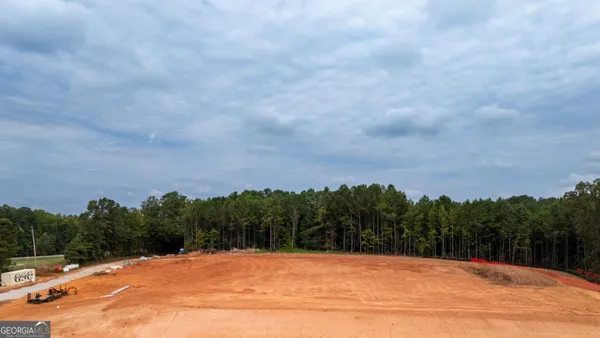 an aerial view of house with yard swimming pool and outdoor seating