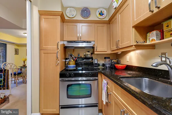 a kitchen with a stove and a sink