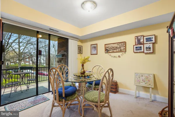 a view of a livingroom with furniture and lounge chair