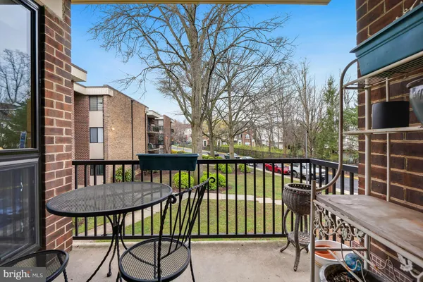 a view of a balcony and chairs