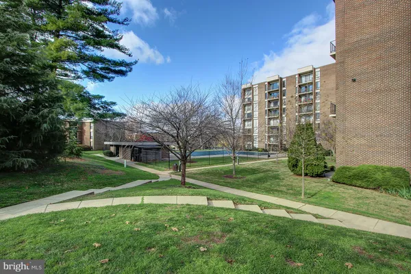 a view of a big yard and front of a building