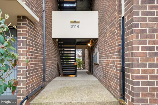 a view of a door with brick wall