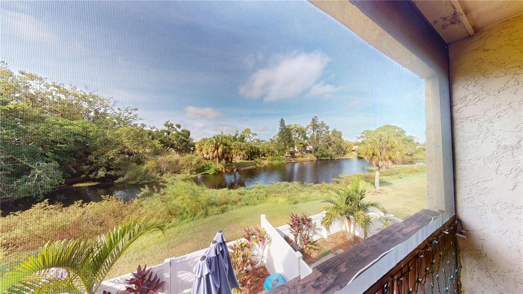 3415 Clark Road, Unit 215 Sarasota, FL 34231 - Photo 17 of 18 a view of a lake from a balcony
