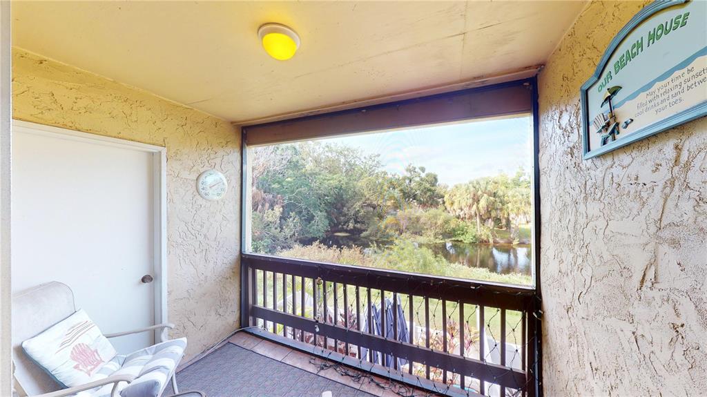 3415 Clark Road, Unit 215 Sarasota, FL 34231 - Photo 18 of 18 a view of a room with furniture and window